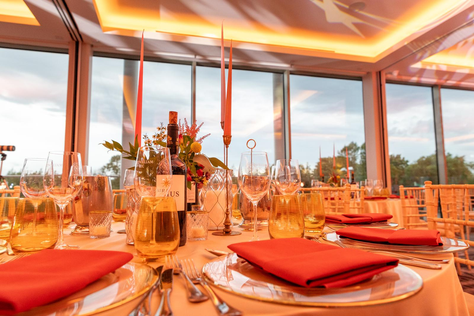 A candlelit event table styled with florals