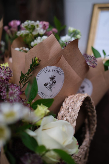 Wrapped bouquets with hand-tied labels