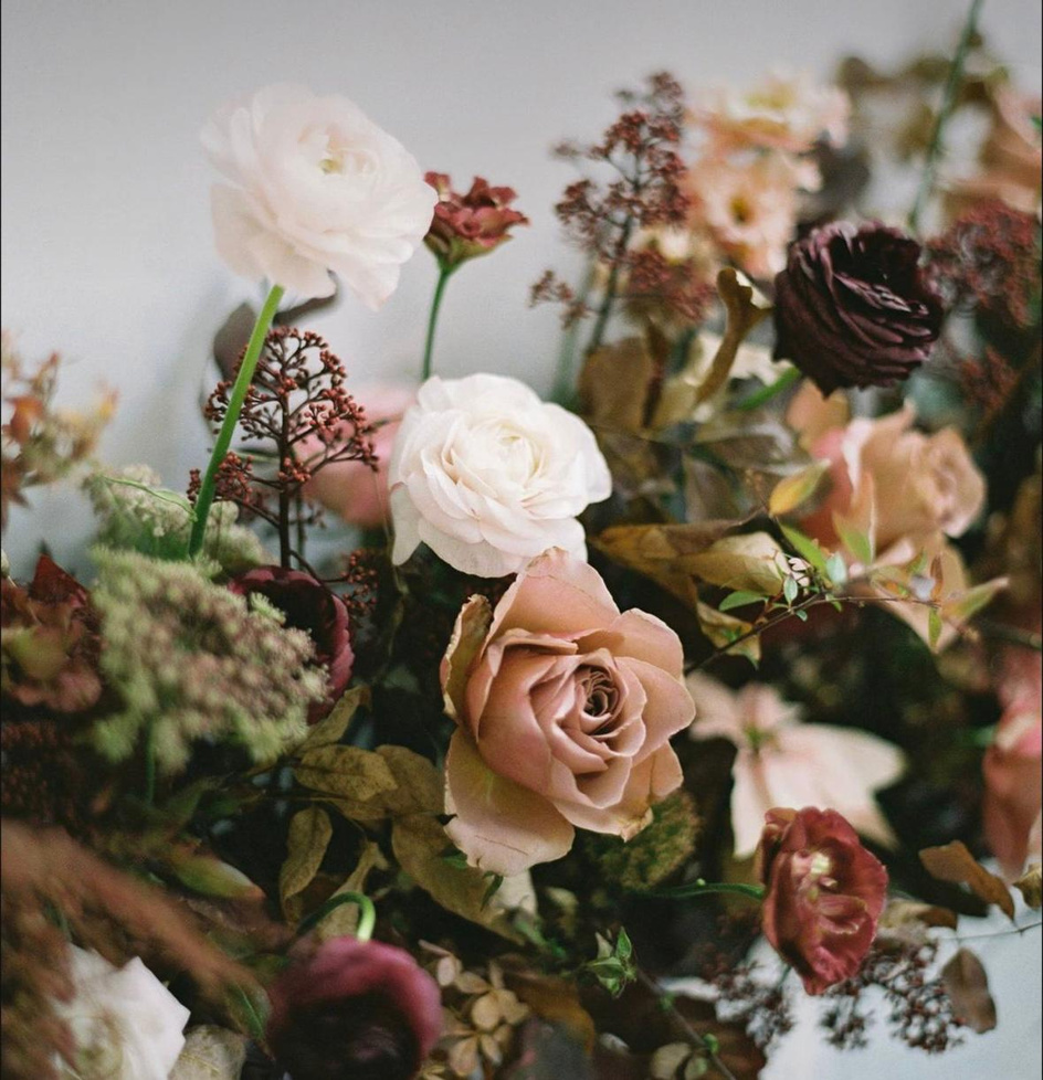 Blush and ivory roses gathered in the studio